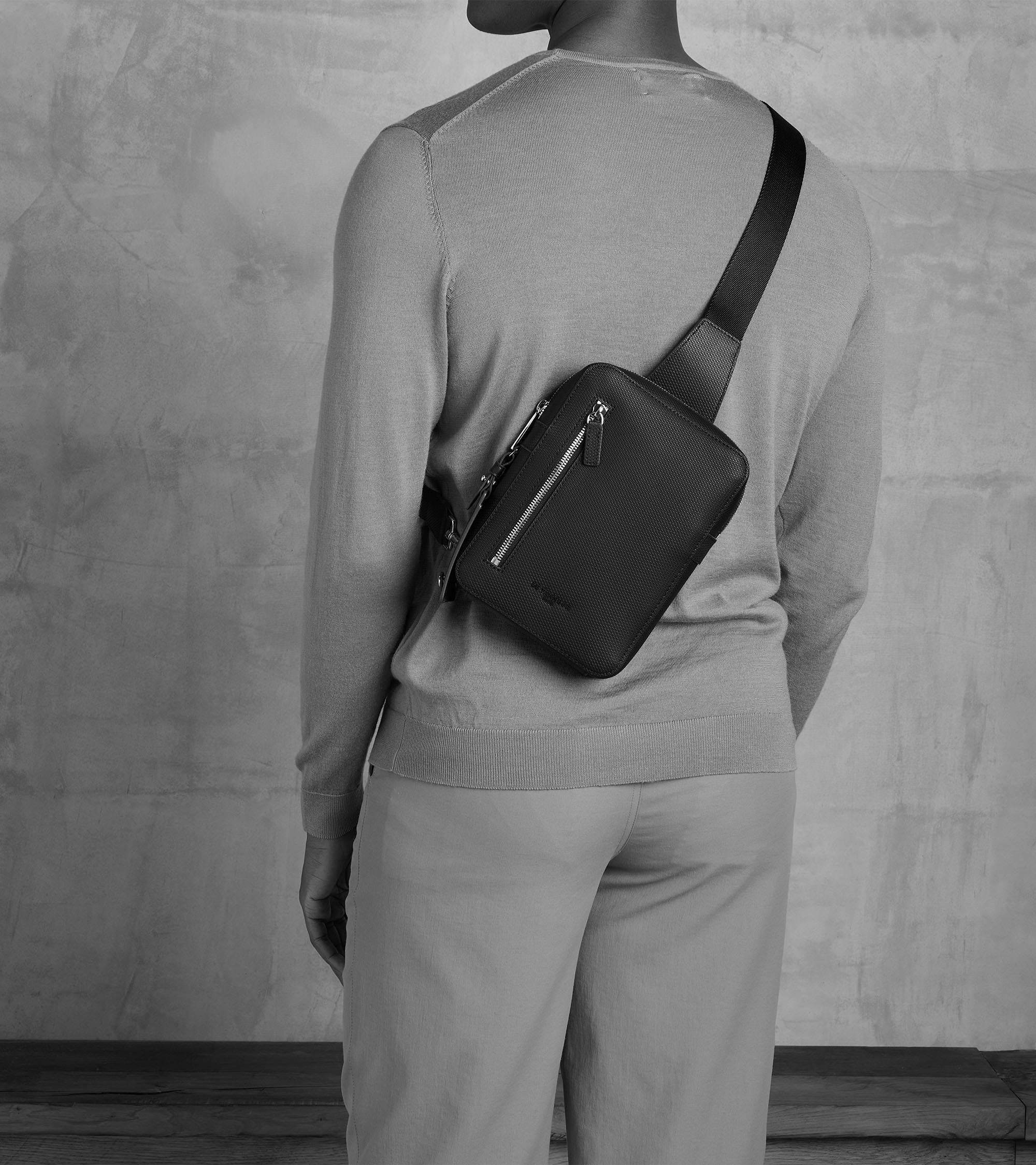 Emile sling satchel in monogrammed leather